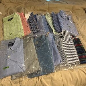 16 Men’s dress shirts in dry cleaner bags